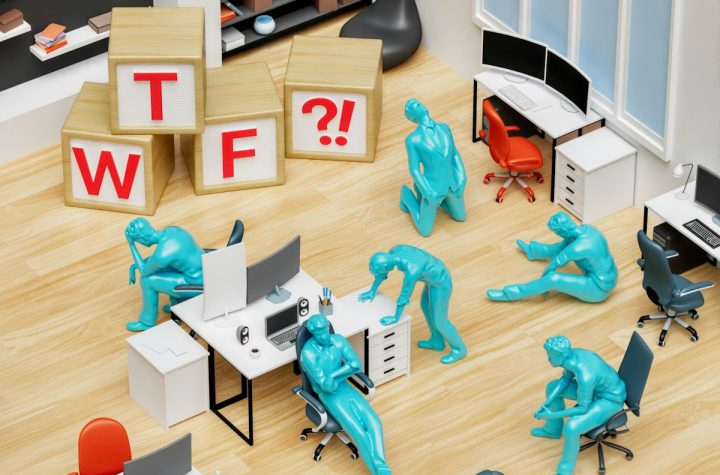 a group of blue plastic figures sitting in an office